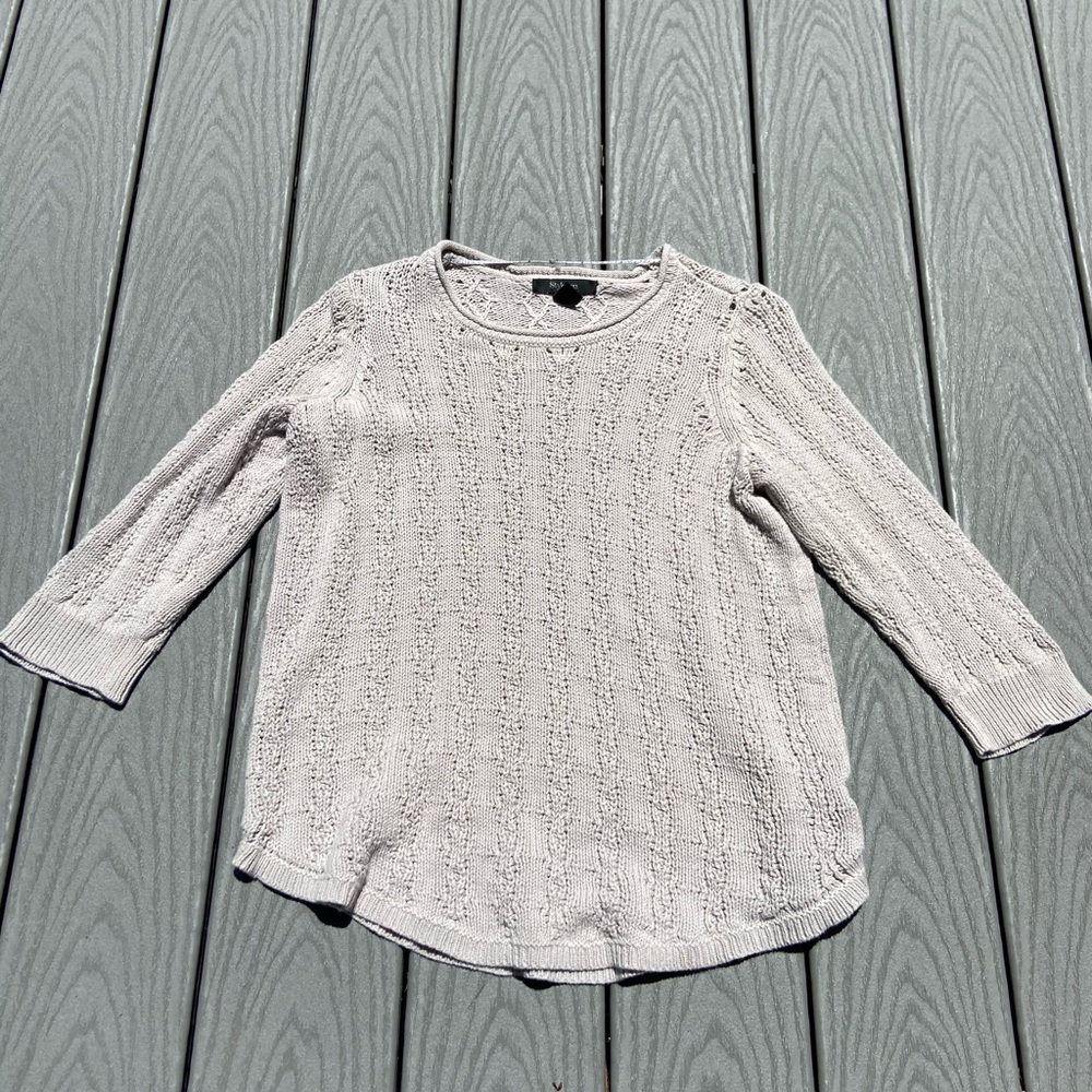 Tan sweater.